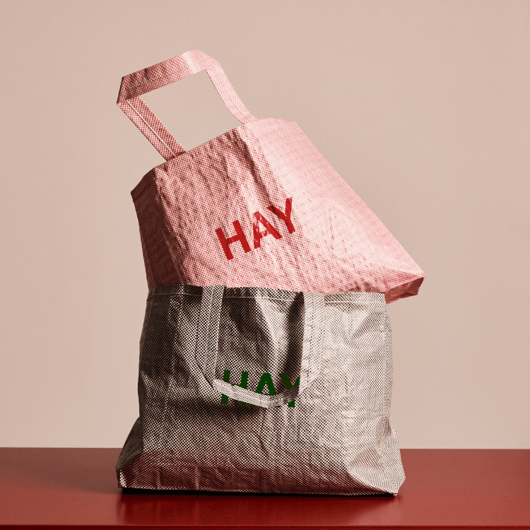 Candy Mono Bags: Stacked pink HAY bag on a gray bag, stylish reusable shopping bags for everyday use.