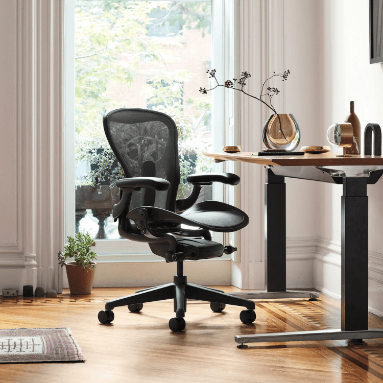 Herman Miller Aeron Chair in Graphite, Size C. Ergonomic office chair with mesh back for comfort and support.