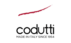Codutti logo, an Italian brand established in 1954, featuring a red brushstroke and elegant black lettering.