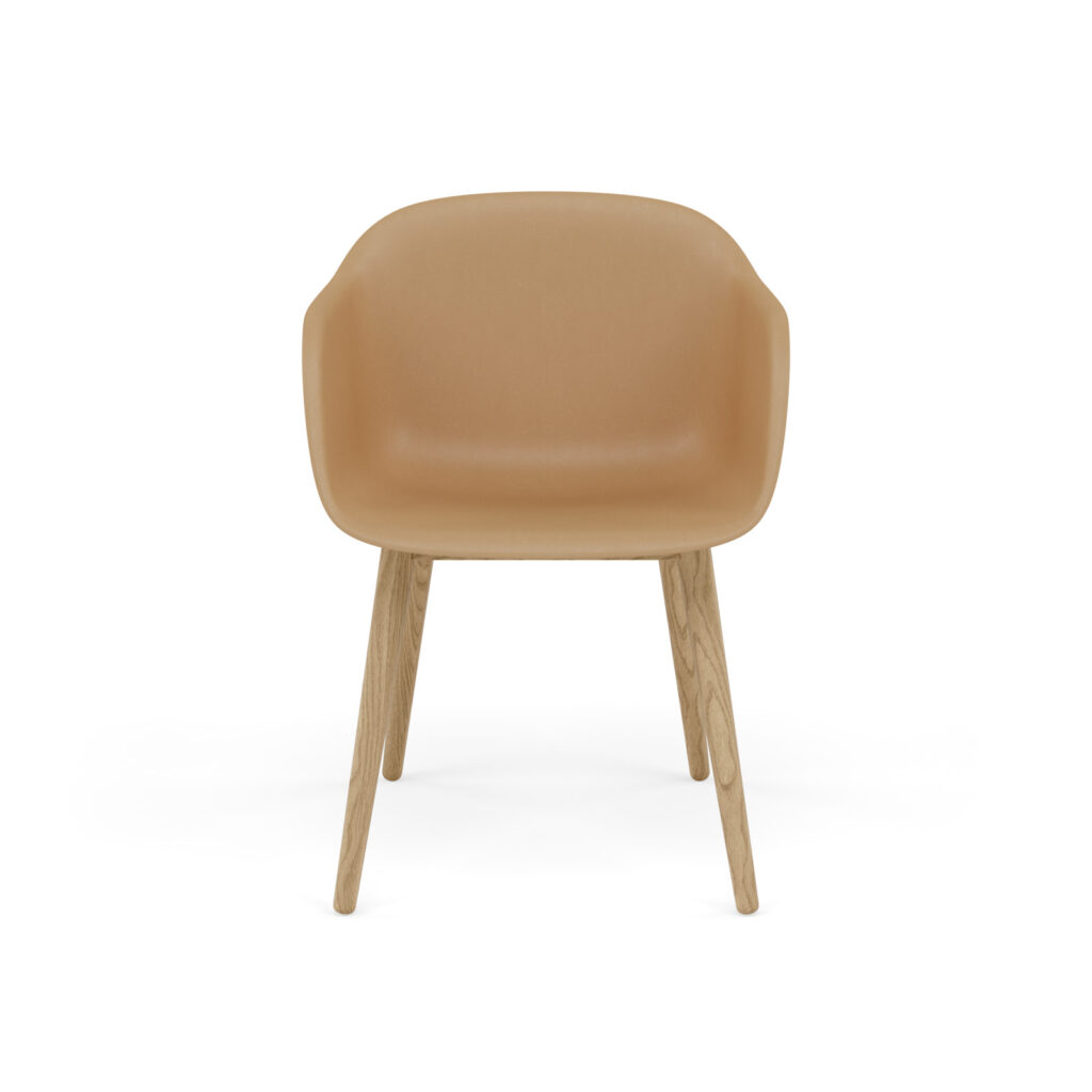 Tan upholstered chair with a curved backrest and four light wood legs, viewed from the front.